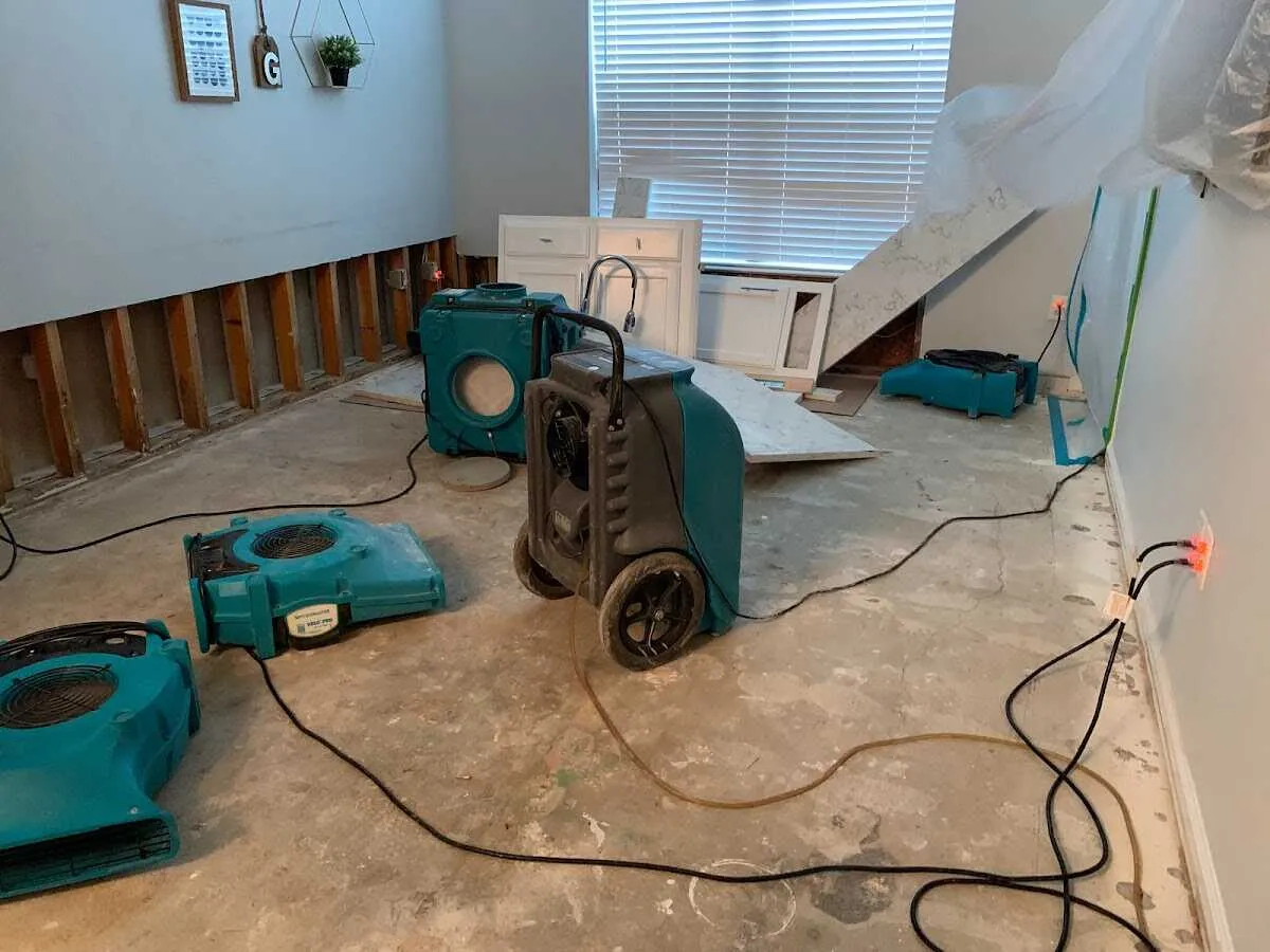 Dehumidifier in flood-cut room for Water Damage Restoration in Martin